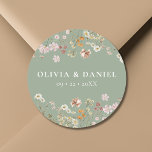 Boho Wildflower Sage Green Garden Wedding Ronde Sticker<br><div class="desc">Voeg een charmant tintje toe aan uw trouwbriefpapier of favorieten met onze Boho Wildflower Garden Wedding Classic Round Sticker. Deze veelzijdige sticker is voorzien van delicate wilde bloemenillustraties op een zacht beige achtergrond en is ideaal voor het afdichten van enveloppen, het versieren van favoriete tassen of het toevoegen van een...</div>