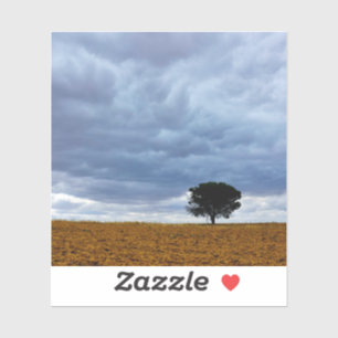Boom in een leeg veld sticker