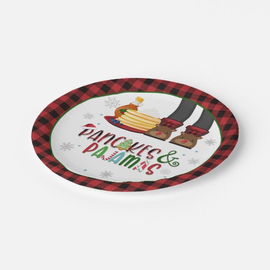 Bord van pannenkoeken en pyjama's met kerstfeest - (Gekanteld)