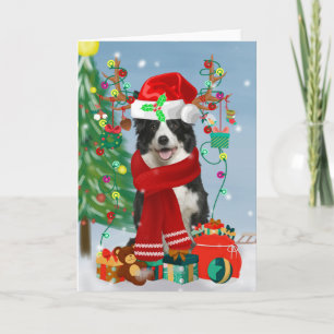 Border Collie hond in de sneeuw met kerstcadeaus  Kaart