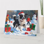 Border Collie in kerstmuts speelt in de sneeuw Kaart (Voorkant)