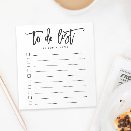 Borstel met persoonlijke titel om lijst uit te voe notitieblok