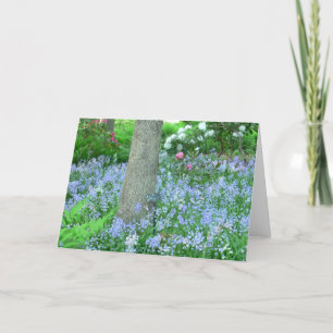 BOSHELLING BEDEKT MET BLAUWE WILDE BLOEMEN KAART