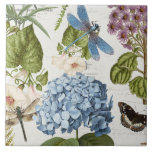 Botanische Dragonfly Bloemtuin Bloemen  4 Tegeltje<br><div class="desc">Nr. 5 van 5 coördinerende tegel afbeeldingen. Diepblauwe libel steelt het show in deze collage met botanische blauwe hortensia, vlinder, damselvlieg, ochtendglorie en scripthandschrift efemera en antiek adverteren afbeeldingen over een zacht crème, ivoren textuur achtergrond. Collage gemaakt en grafisch ontworpen door internationaal erkende kunstenaar en ontwerper, Audrey Jeanne Roberts, copyright....</div>