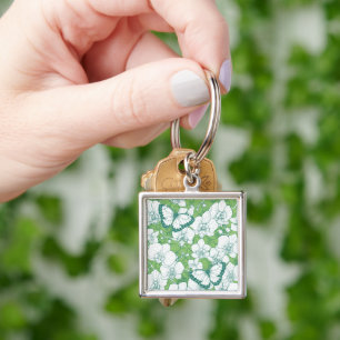 Botanische orchideeën tuin met vlinders in het gro sleutelhanger