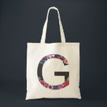 Botanische paarse bloemen letter G monogram Tote Bag<br><div class="desc">Botanische paarse bloemen letter g monogram Canvas tas | Moderne en elegante monogram canvas tas met waterverf illustratie van bloemen met een houtskool achtergrond. Deze botanische canvas tas zal een perfect persoonlijk geschenk zijn. Andere letters en kleuren zijn beschikbaar.</div>