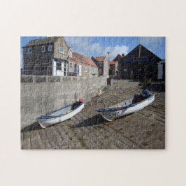 boten en oude flint gebouwen originele foto op het legpuzzel