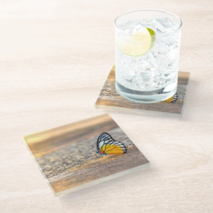 Boter op de strand glazen onderzetter