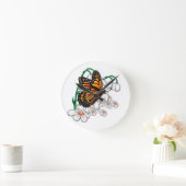 Botervlieg op bloemen ronde klok (Huis)
