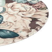 Botervliegen en bruine bloemen snijplank (Hoek)