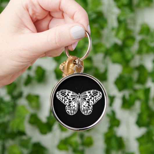 Botervliegschets, wit en zwart sleutelhanger (Hand)