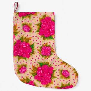 Bouquets van paarse rozen op een bleke roze achter kleine kerstsok