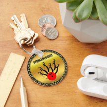 Bowling ball en spelden met het woord STRIKEOLOGIS