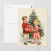 Boy and girl giving each other Christmas presents Briefkaart (Voorkant / Achterkant)