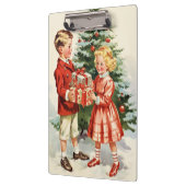 Boy and girl giving each other Christmas presents Klembord (Links)