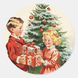 Boy and girl giving each other Christmas presents Ronde Sticker