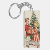 Boy and girl giving each other Christmas presents Sleutelhanger (Voorkant Links)