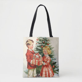 Boy and girl giving each other Christmas presents Tote Bag