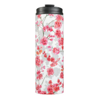 Branches of cherry blossoms on white and grey back thermosbeker