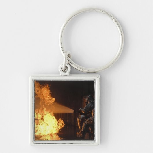 Brandblussers blussen een gesimuleerde batterijvez sleutelhanger (Voorkant)