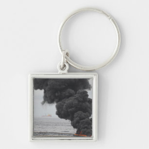 Brandwonden van geconcentreerde kolie sleutelhanger