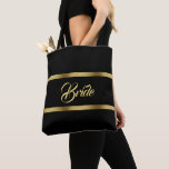 Bride zwarte goudbruine bruine bruine bruiloft tote bag<br><div class="desc">Twee faux gouden linten, met het woord: Bride in een handgeschreven stijlscript, gouden letters. Elegante en tijdloze zwarte achtergrondkleur.</div>