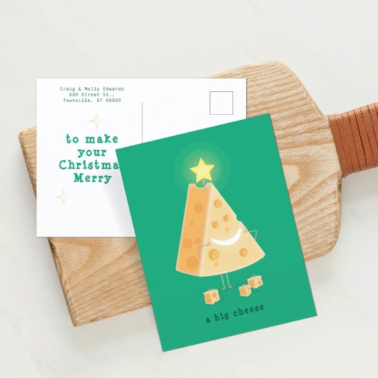 Briefkaart voor kerstmis met een grote kaas