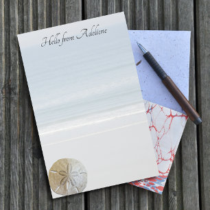 Briefpapier met stranddoller achtergrond