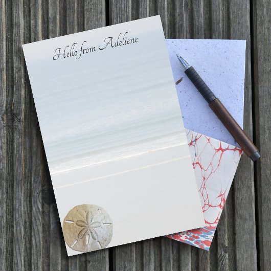 Briefpapier met stranddoller achtergrond