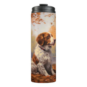 Brittany Spaniel in herfstbladeren val inspireert Thermosbeker