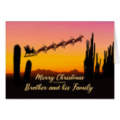 Broer en kerstman met kerstman over woestijn (Voorkant Horizontaal)