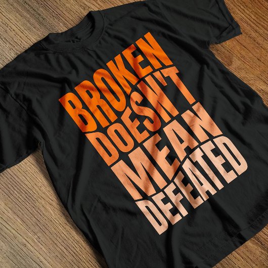 Broken Doesn’t Mean Defeated  T-shirt