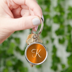 Brons glanzend faux metal monogram sleutelhanger
