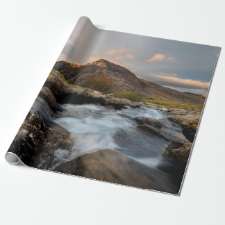 BROWN MOUNTAIN NEAR BODY OF WATER UNDER CLOUDY SKY CADEAUPAPIER