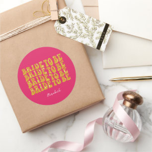 Bruid wordt gouden glittertekst met naam, roze ronde sticker