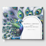 Bruiloft Gastenboek Majestic Peacock<br><div class="desc">Nodig uw bruiloftsgasten uit om hun wensen en wijsheid te delen met dit gastenboek met een waterverf pauw met pluimen van veren in tinten van koningsblauw, groen en paarse. Uw namen en trouwdatum worden in klassieke letters weergegeven. Het boek keert terug naar een bijpassend patroon van pauwenveren. Voor meer bruiloft...</div>