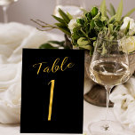 Bruiloft gouden glitter zwart elegant tafelnummer<br><div class="desc">Faux gouden folie formele kalligrafie script bruiloft receptie tafel kaart. De zwarte achtergrondkleur kan worden bewerkt. U kunt deze wijzigen nadat u de knop VERDER AANPASSEN hebt geselecteerd. U vindt het hele bereik van nummers ( 1 - 50) hier: http://bit.ly/2sLMaFh</div>