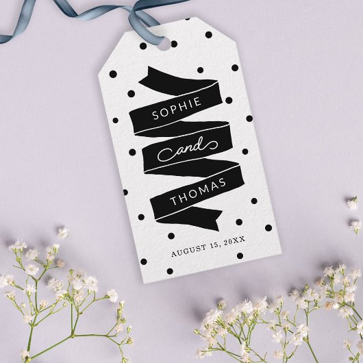 Bruiloftsgeschenk met stippen en lint cadeaulabel