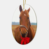 Bruin kerstpaard en rode boe keramisch ornament (Links)