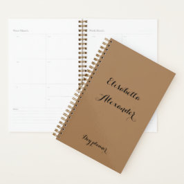 Bruin met zwarte tekstdagplanner en naamplaats. planner