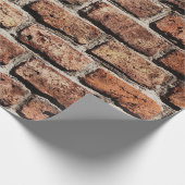 Bruine bakstenen muur op zonlicht cadeaupapier (Hoek)