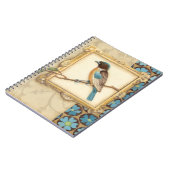 Bruine en blauwe vogel op een bijkantoor die omhoo notitieboek (Linkerzijde)