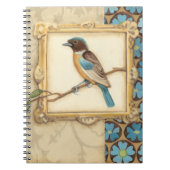 Bruine en blauwe vogel op een bijkantoor die omhoo notitieboek (Voorkant)