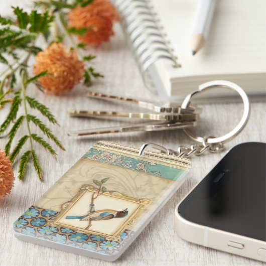 Bruine en blauwe vogel op een bijkantoor die omhoo sleutelhanger (Voorkant Rechts)