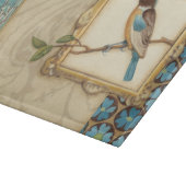 Bruine en blauwe vogel op een bijkantoor die omhoo snijplank (Hoek)