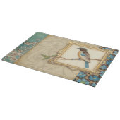 Bruine en blauwe vogel op een bijkantoor die omhoo snijplank (Hoek)