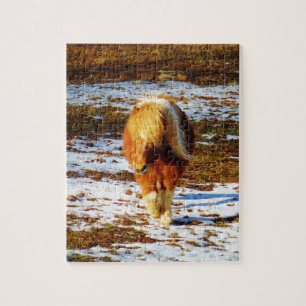 Bruine en crème miniatuurpaard in de sneeuw. legpuzzel