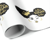 Bruine suikerbaby in zwart en goud cadeaupapier (Rol Hoek)