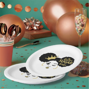 Bruine suikerbaby in zwart en goud papieren bordje