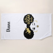 Bruine suikerbaby in zwart en goud strandlaken (Voorkant)